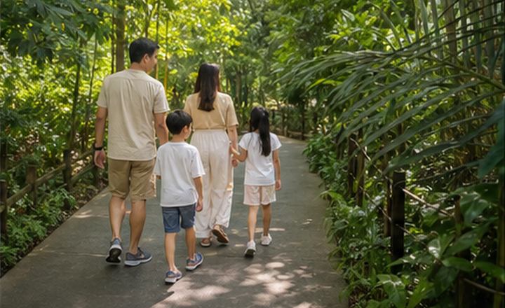 Family walking through a shaded pathway